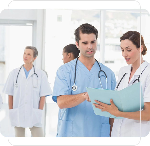 A group of doctors standing in a room.